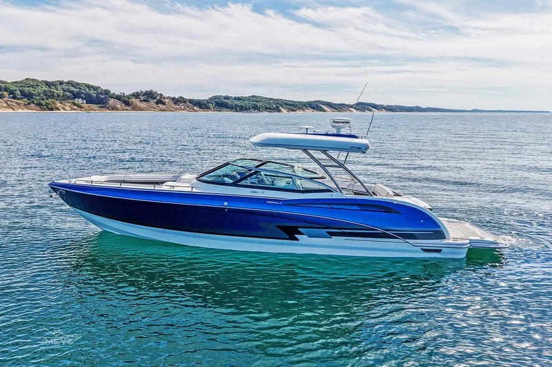  Yacht Photos Pics 2018 Formula 350 FX Crossover Bowrider on serene water with scenic coastline.
