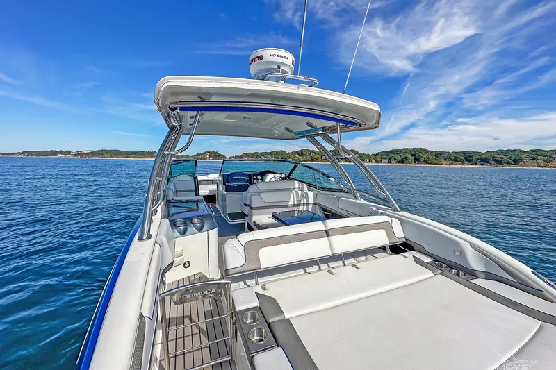  Yacht Photos Pics 2018 Formula 350 FX Crossover Bowrider on serene blue waters under clear skies.