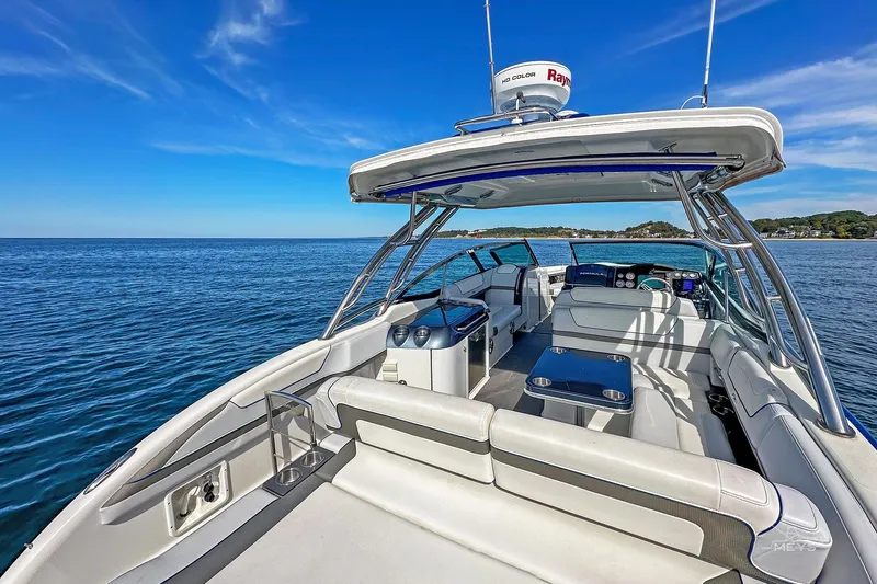  Yacht Photos Pics 2018 Formula 350 FX Crossover Bowrider on open water, showcasing luxury seating and helm.