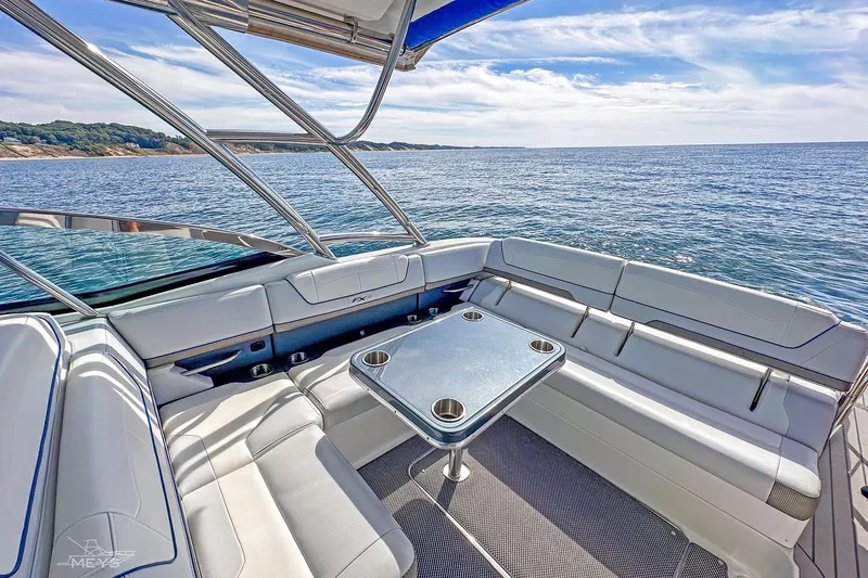  Yacht Photos Pics 2018 Formula 350 FX Crossover Bowrider interior with ocean view, featuring sleek seating and table.