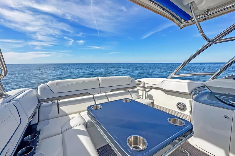  Yacht Photos Pics 2018 Formula 350 FX Crossover Bowrider interior with ocean view, featuring seating and table.