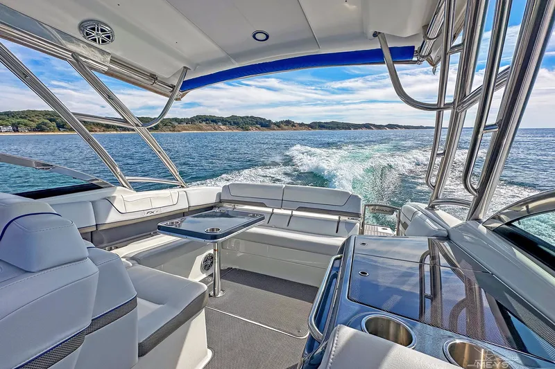  Yacht Photos Pics 2018 Formula 350 FX Crossover Bowrider cruising on open water, featuring luxurious seating.