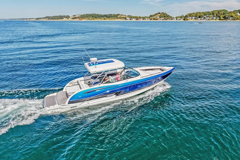  Yacht Photos Pics 2018 Formula 350 FX Crossover Bowrider cruising on clear blue water.
