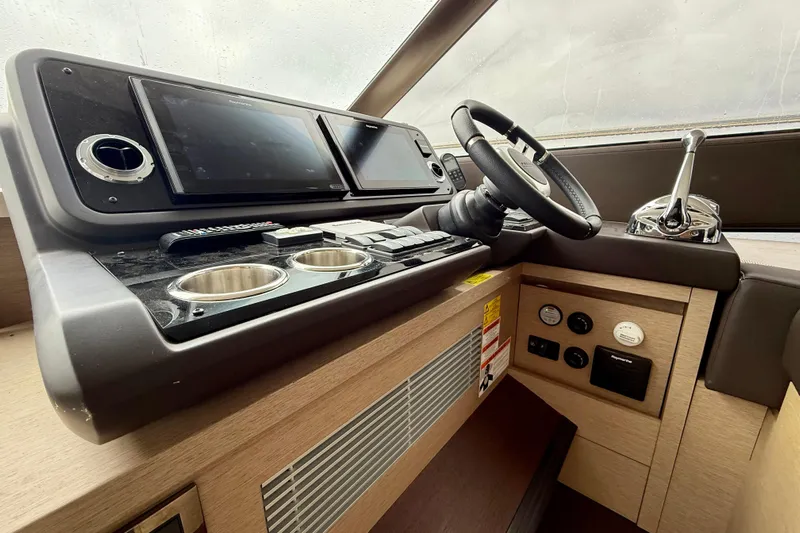 Freiheit Yacht Photos Pics 2020 Prestige 590 yacht helm with modern controls and dual displays.