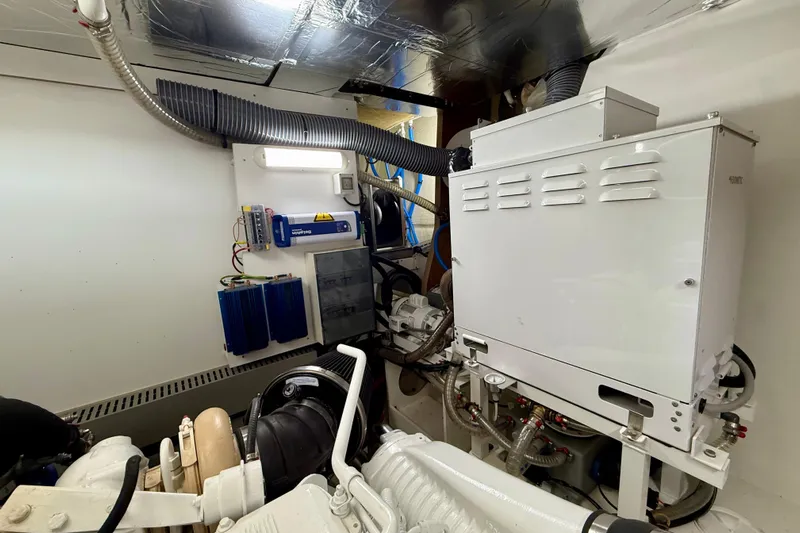 Freiheit Yacht Photos Pics Engine room of a 2020 Prestige 590 yacht, featuring mechanical and electrical systems.