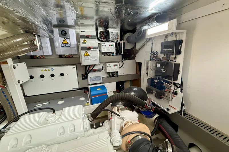 Freiheit Yacht Photos Pics Engine room of a 2020 Prestige 590 yacht with electrical systems and components.