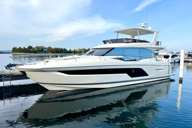 Freiheit Yacht Photos Pics Luxury 2020 Prestige 590 yacht docked in serene marina setting.