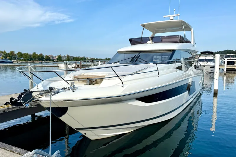 Freiheit Yacht Photos Pics Luxury 2020 Prestige 590 yacht docked at marina on a sunny day.