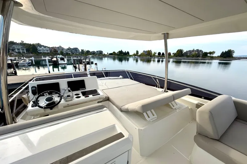 Freiheit Yacht Photos Pics Luxurious 2020 Prestige 590 yacht interior with serene waterfront view.