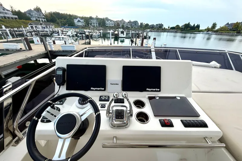 Freiheit Yacht Photos Pics Helm of 2020 Prestige 590 yacht with Raymarine displays at marina.
