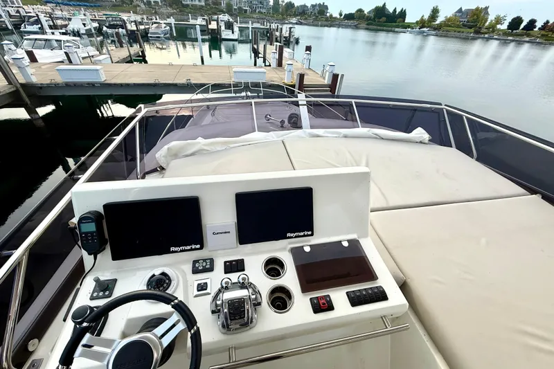 Freiheit Yacht Photos Pics Cockpit view of 2020 Prestige 590 yacht with navigation equipment at marina.