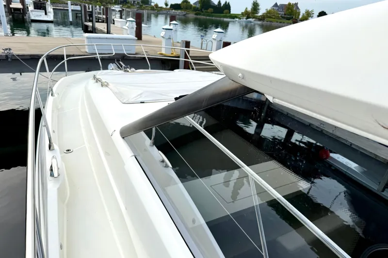 Freiheit Yacht Photos Pics 2020 Prestige 590 yacht docked at marina, showcasing sleek design and modern features.