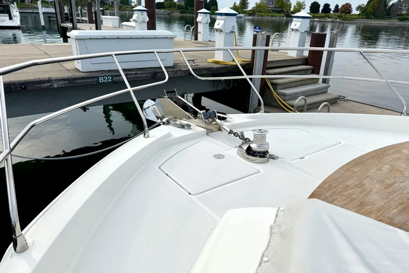 Freiheit Yacht Photos Pics Bow of a 2020 Prestige 590 yacht docked at a marina.