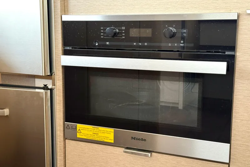 Freiheit Yacht Photos Pics Modern Miele oven in a Prestige 590, 2020 model, with sleek black and stainless steel design.