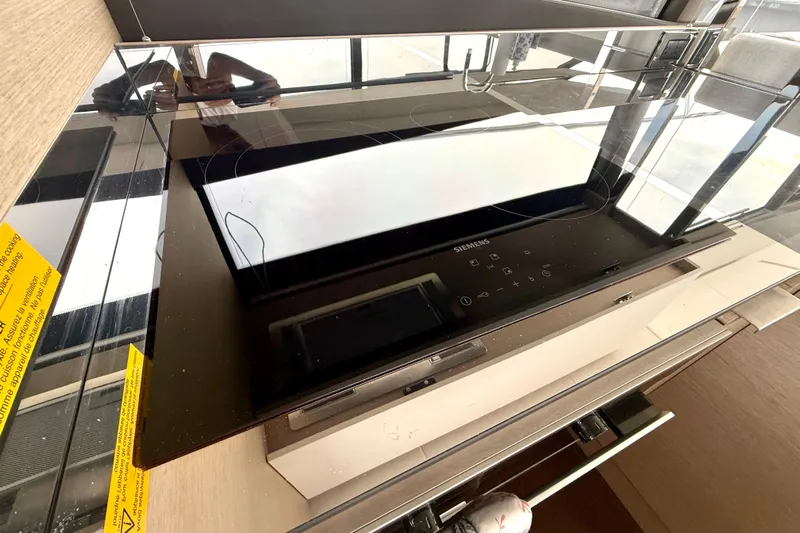 Freiheit Yacht Photos Pics Modern Siemens induction cooktop in a 2020 Prestige 590 kitchen setup.