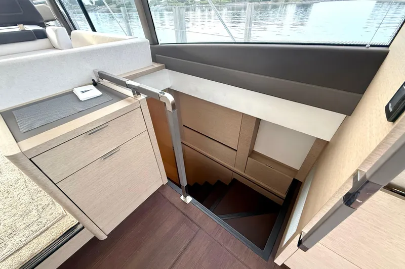 Freiheit Yacht Photos Pics Interior of 2020 Prestige 590 yacht showing stairs and modern cabinetry design.
