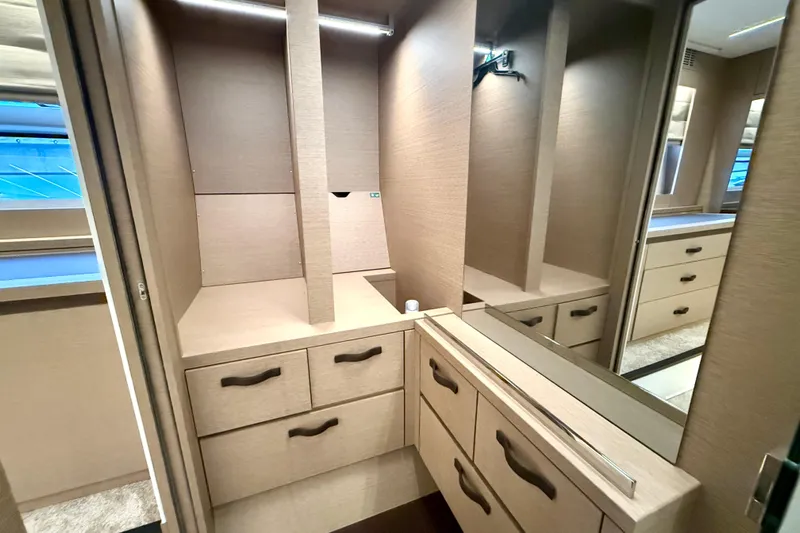 Freiheit Yacht Photos Pics Luxurious interior of 2020 Prestige 590 yacht with modern cabinetry and ample storage.