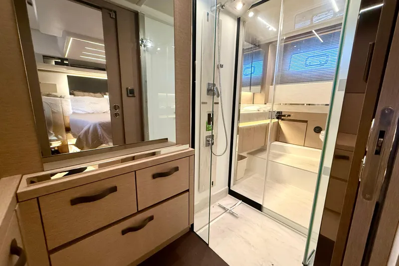 Freiheit Yacht Photos Pics Luxurious bathroom interior of 2020 Prestige 590 yacht with modern shower and vanity.
