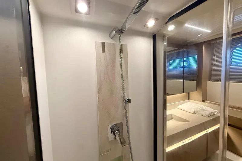Freiheit Yacht Photos Pics Luxurious bathroom interior of 2020 Prestige 590 yacht with modern shower and vanity.