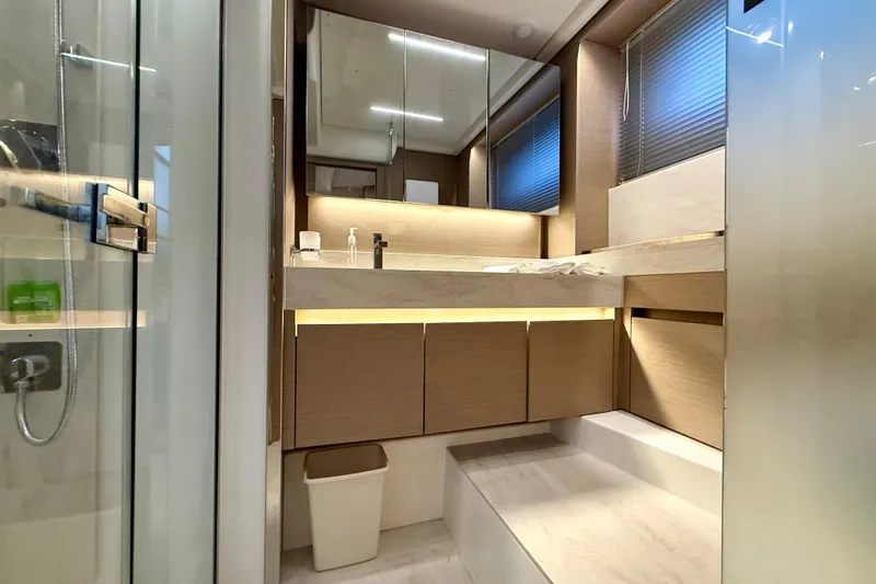 Freiheit Yacht Photos Pics Luxurious bathroom interior of 2020 Prestige 590 yacht with modern fixtures and elegant design.