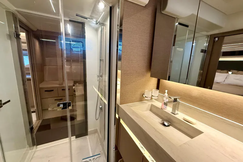 Freiheit Yacht Photos Pics Luxurious bathroom interior of 2020 Prestige 590 yacht with modern fixtures and elegant design.