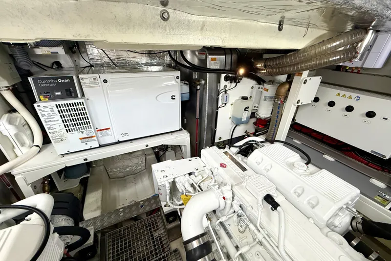 Freiheit Yacht Photos Pics Engine room of a 2020 Prestige 590 yacht with Cummins Onan generator.