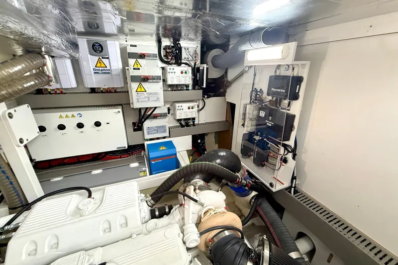 Freiheit Yacht Photos Pics Engine room of a 2020 Prestige 590 yacht, featuring advanced electrical systems and components.