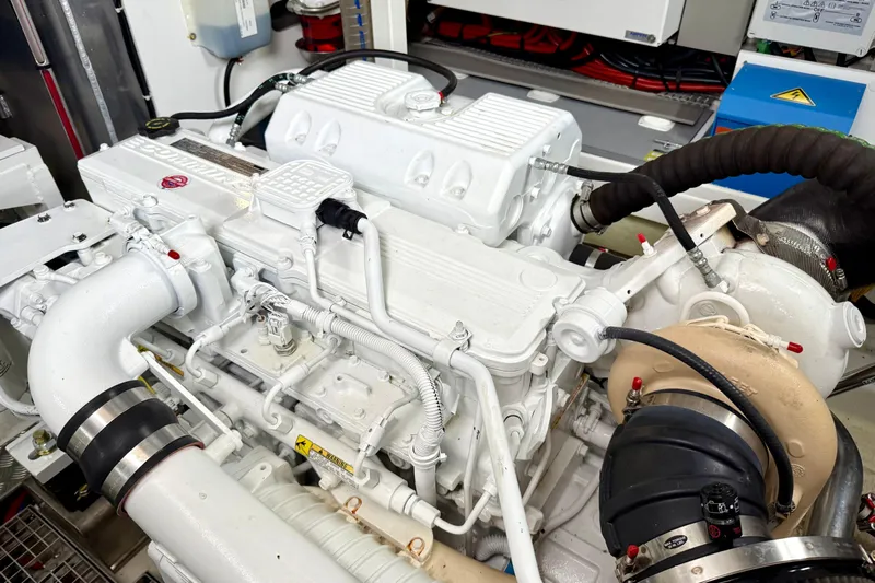 Freiheit Yacht Photos Pics Engine room of a 2020 Prestige 590 yacht, showcasing detailed mechanical components.
