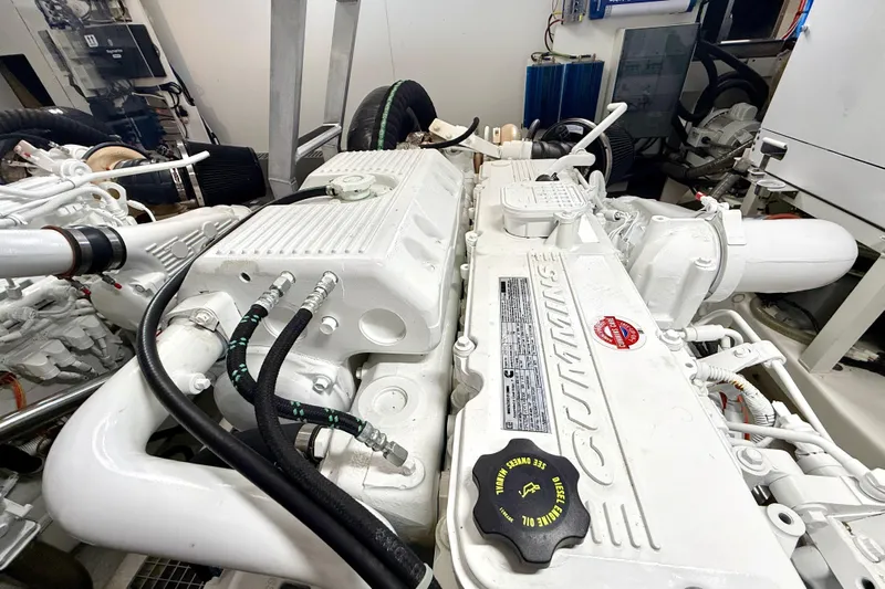 Freiheit Yacht Photos Pics Engine room of a 2020 Prestige 590 yacht featuring a Cummins diesel engine.
