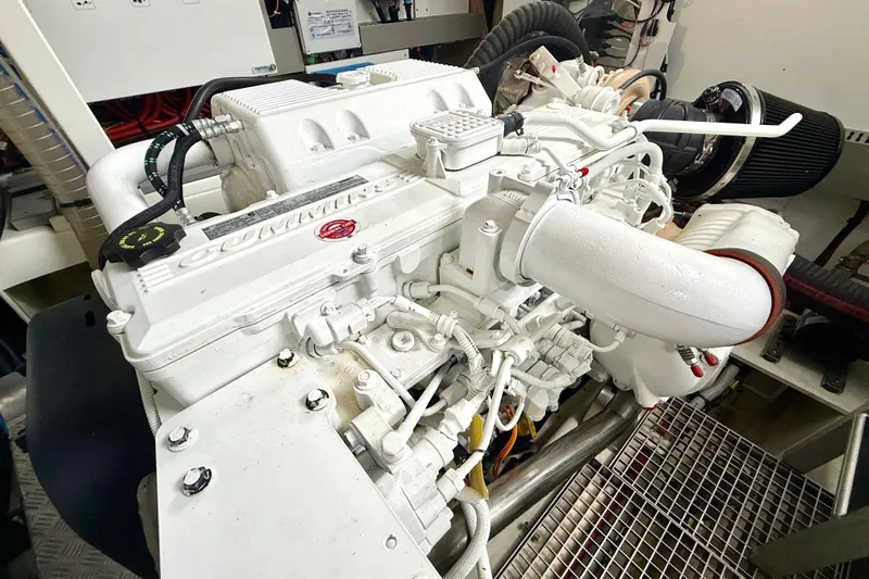 Freiheit Yacht Photos Pics Engine room of 2020 Prestige 590 yacht featuring a Cummins engine.