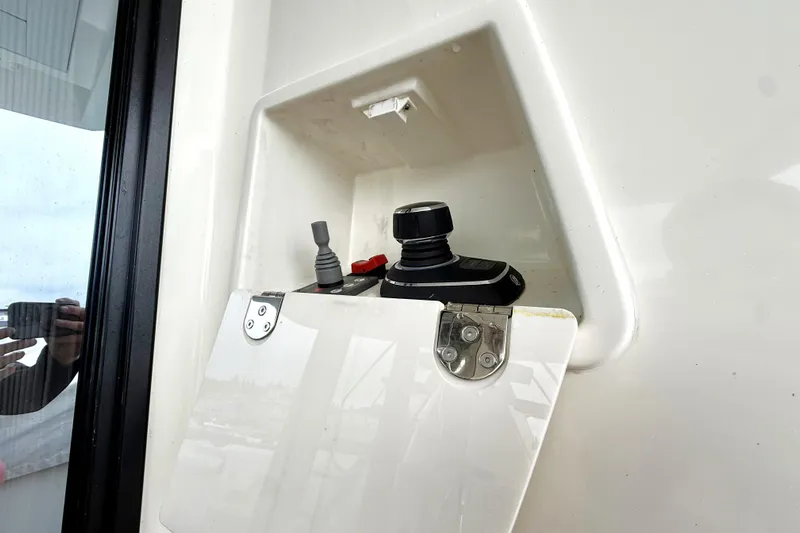 Freiheit Yacht Photos Pics Control panel of a 2020 Prestige 590 yacht with joystick and switches.