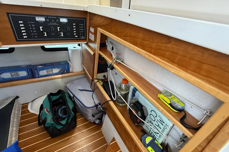 Frisky Yacht Photos Pics 2022 Cutwater C-32 CB interior with control panel, storage shelves, and equipment.