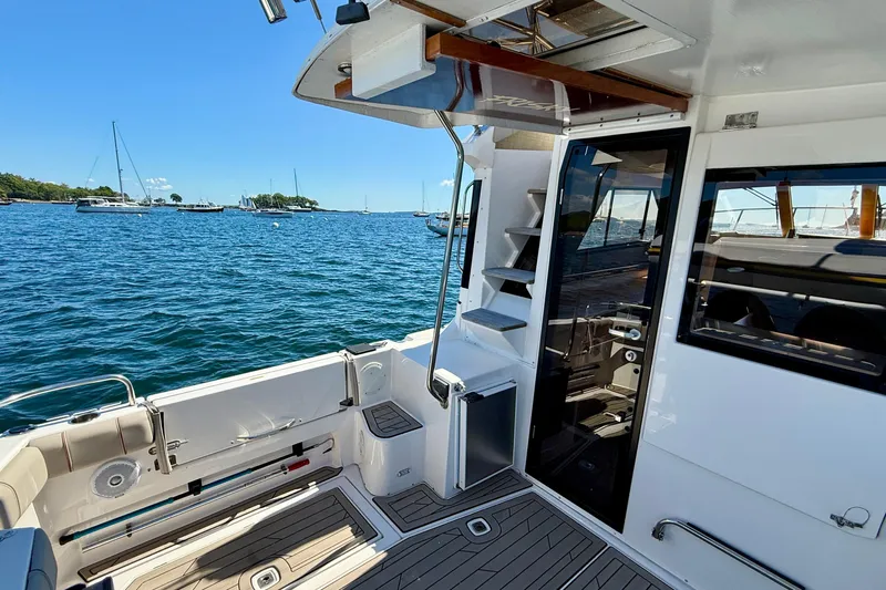 Frisky Yacht Photos Pics 2022 Cutwater C-32 CB boat interior with ocean view and sleek design.