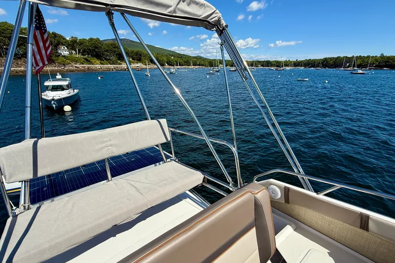 Frisky Yacht Photos Pics 2022 Cutwater C-32 CB boat on scenic lake with clear blue skies.
