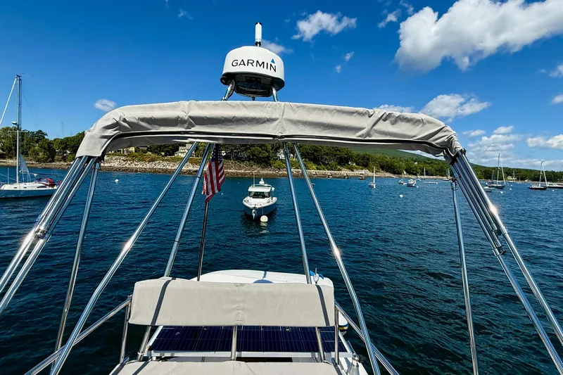 Frisky Yacht Photos Pics 2022 Cutwater C-32 CB boat with Garmin radar on a sunny day at sea.