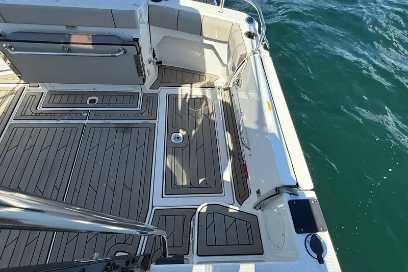 Frisky Yacht Photos Pics 2022 Cutwater C-32 CB boat deck with teak flooring, overlooking the ocean.