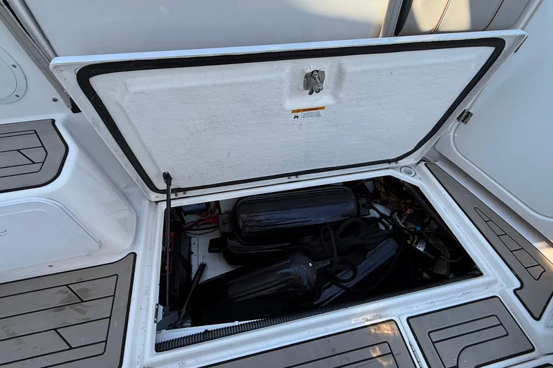 Frisky Yacht Photos Pics 2022 Cutwater C-32 CB engine compartment with open hatch, showcasing internal components.
