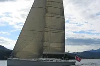 Sailing yacht Custom Felci 71, 2006 model, on calm waters under cloudy sky.