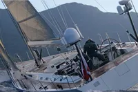 Sailing yacht Felci 71 from 2006 navigating choppy waters with mountainous backdrop.