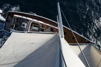 Aerial view of a 2006 Custom Felci 71 sailboat navigating through the ocean.