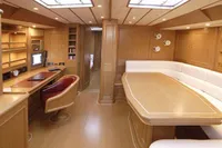Luxurious interior of 2006 Custom Felci 71 yacht with wood finish and modern amenities.