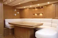 Luxurious interior of 2006 Custom Felci 71 yacht with elegant wood finish and plush seating.