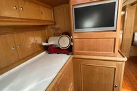 Luxurious wooden interior of 2006 Custom Felci 71 yacht with modern amenities.