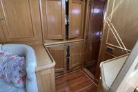 Luxurious wooden interior of 2006 Custom Felci 71 yacht cabin.