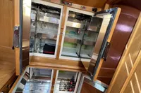 Luxurious yacht kitchen with open stainless steel refrigerators, Custom Felci 71, 2006 model.