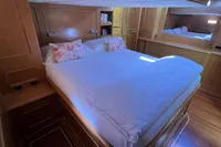 Luxurious cabin interior of 2006 Custom Felci 71 yacht with cozy double bed.