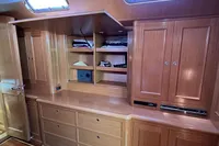 Interior of 2006 Custom Felci 71 yacht with wooden cabinets and drawers.