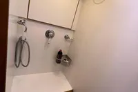 Compact bathroom in a 2006 Custom Felci 71 yacht with modern fixtures and storage.