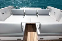 Luxurious seating area on 2019 Fjord 44 Open yacht with ocean backdrop.
