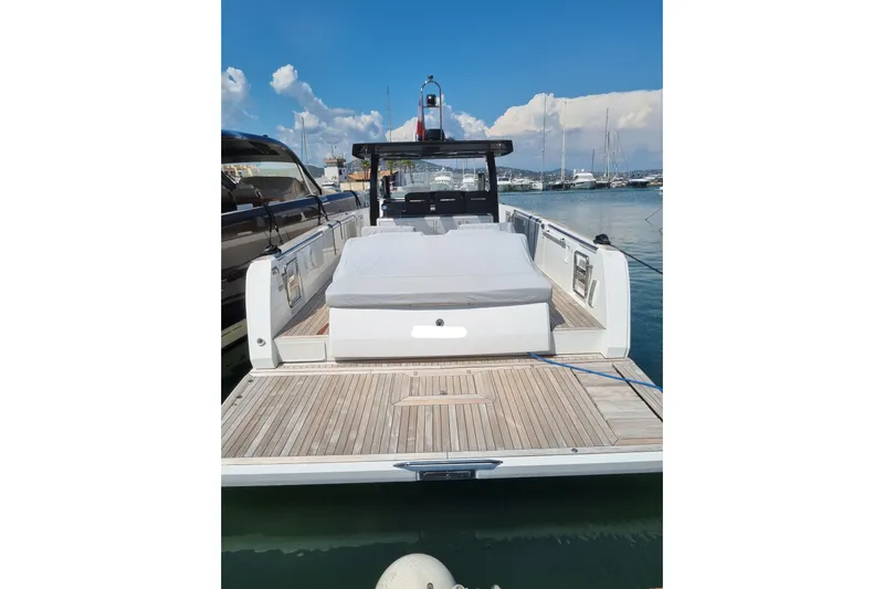  Yacht Photos Pics 2019 Fjord 44 Open yacht with spacious deck and sunbed, docked in marina.